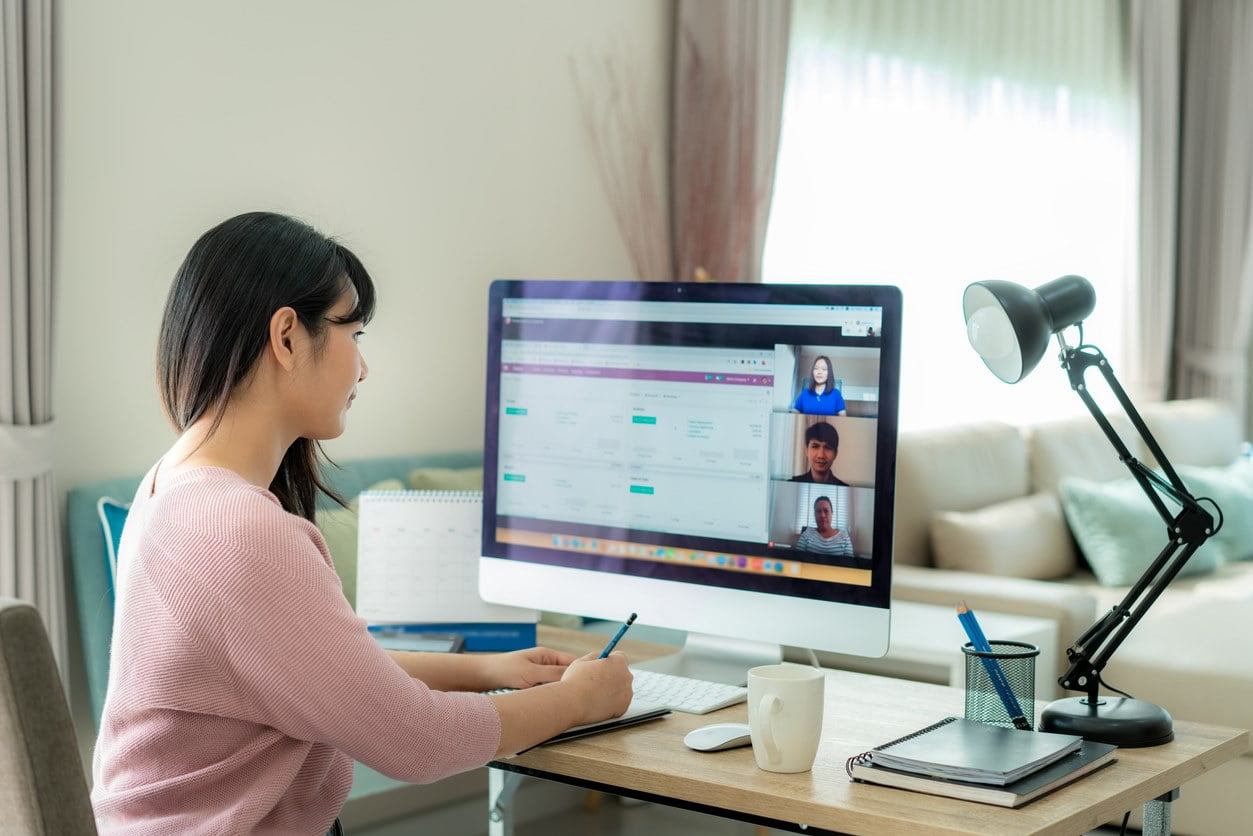 Woman working in front of computer at home