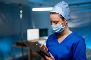 Nurse checking tablet