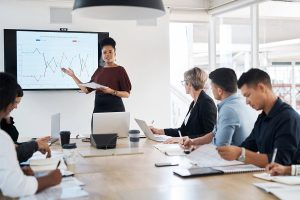 conference room meeting of people analyzing asset management